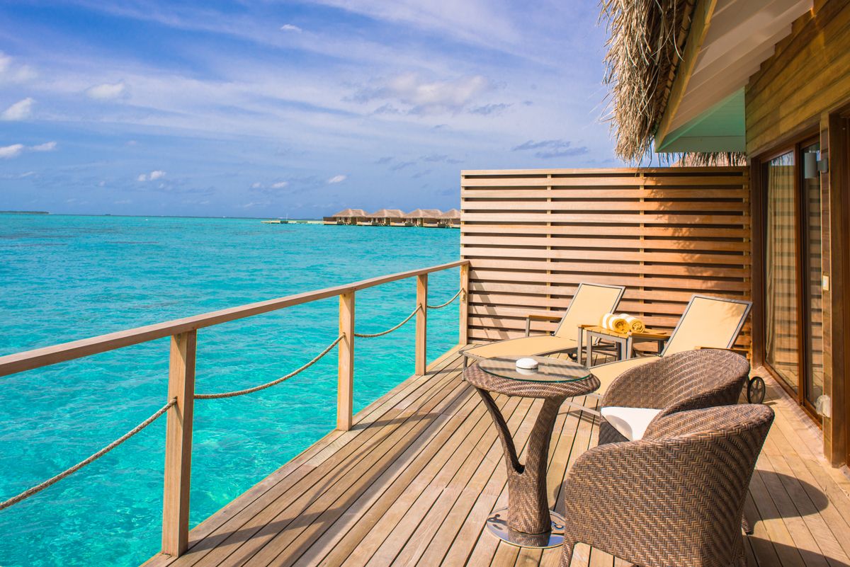 Loungers on a shaded deck over the lagoon