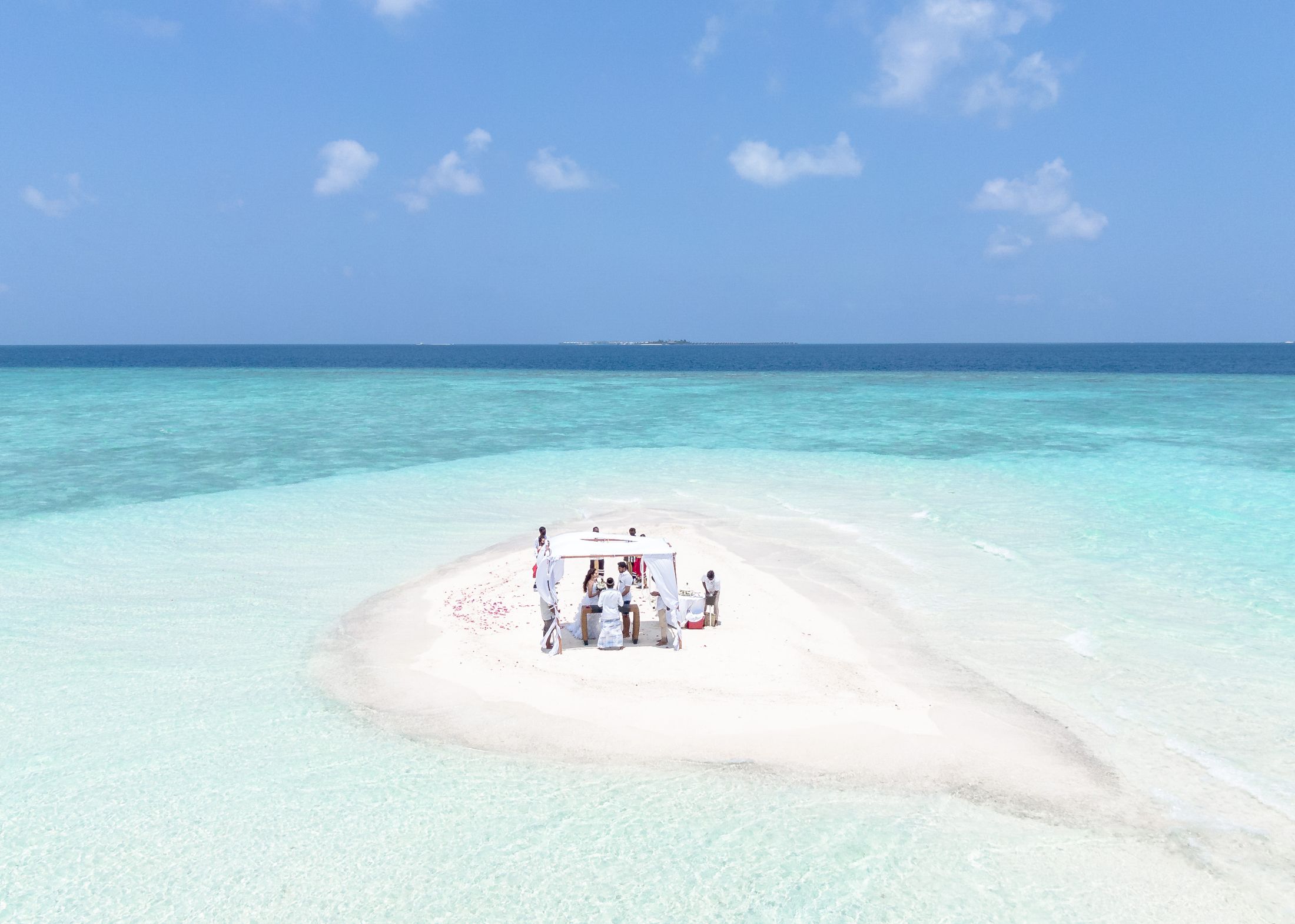 A small sandbank in a shallow turquoise sea